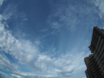 Low angle view of buildings against blue sky