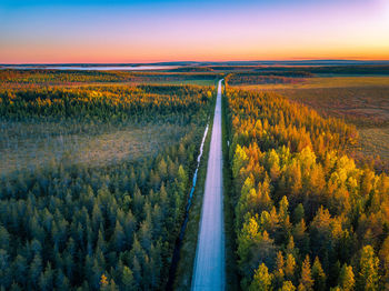 Scenic view of field against sky during sunset