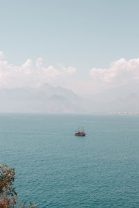 Sailboat on sea against sky