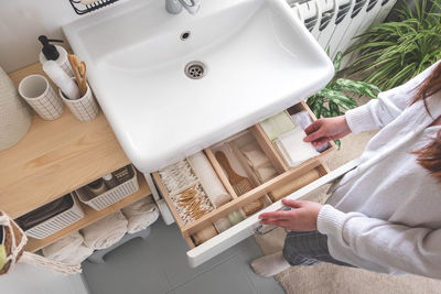 Midsection of woman washing hands