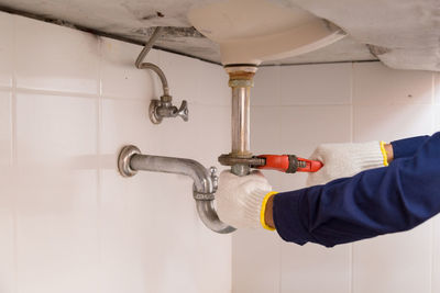 Man working in bathroom