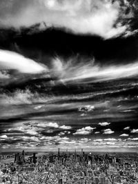 Group of people on beach against sky