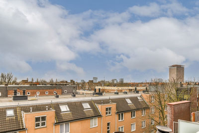 Buildings in city against sky