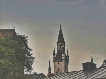 Low angle view of bell tower against sky