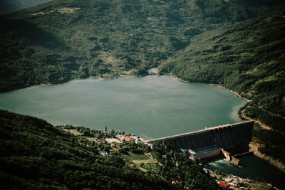 High angle view of river amidst trees against sky