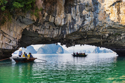 People kayaking in sea