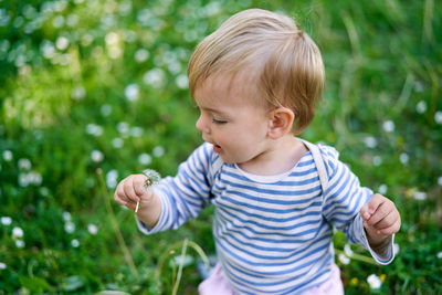 Cute boy against plants