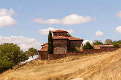 Church on field against sky