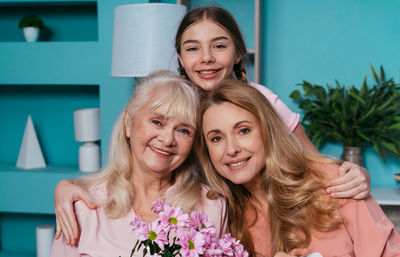 Portrait of cheerful family at home