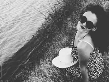 Low section of woman standing in water