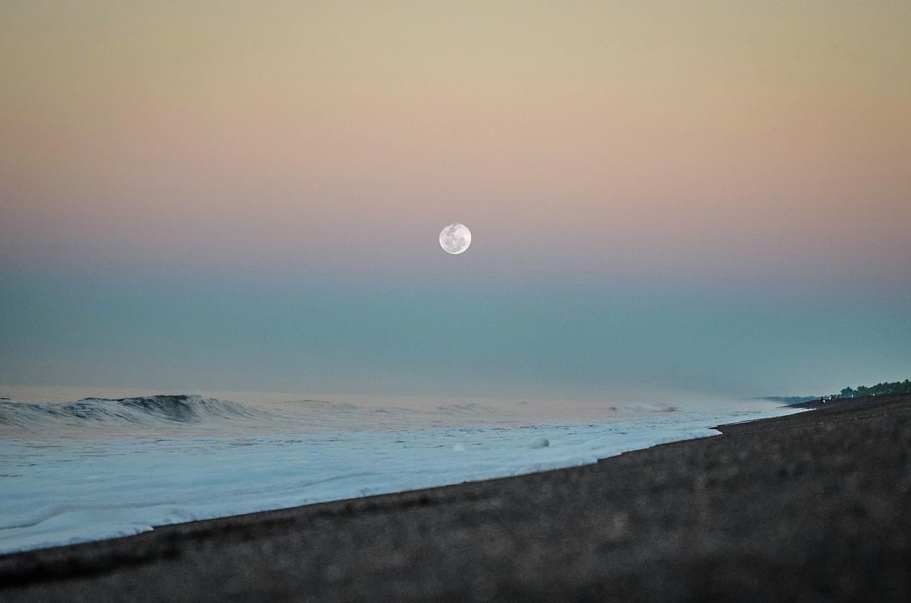moon, nature, beauty in nature, scenics, tranquil scene, sea, sky, tranquility, outdoors, no people, sunset, water, horizon over water, clear sky, crescent, half moon, astronomy, day