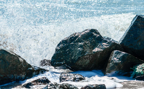 Sea waves splashing on rocks