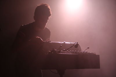 Man playing musical instrument at music concert