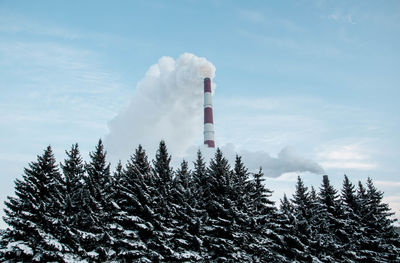 Low angle view of smoke stack against sky