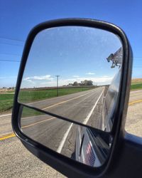 Cropped image of car on road