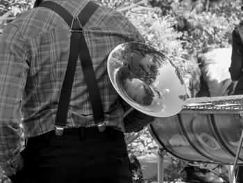 Close-up of man holding musical equipment