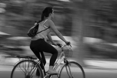 Blurred motion of people walking on road
