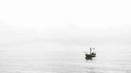 Nautical vessel on sea against sky