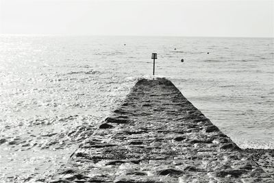 Pier over sea against sky