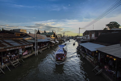 High angle view of canal amidst buildings in city