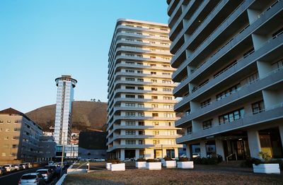 Modern buildings against sky in city