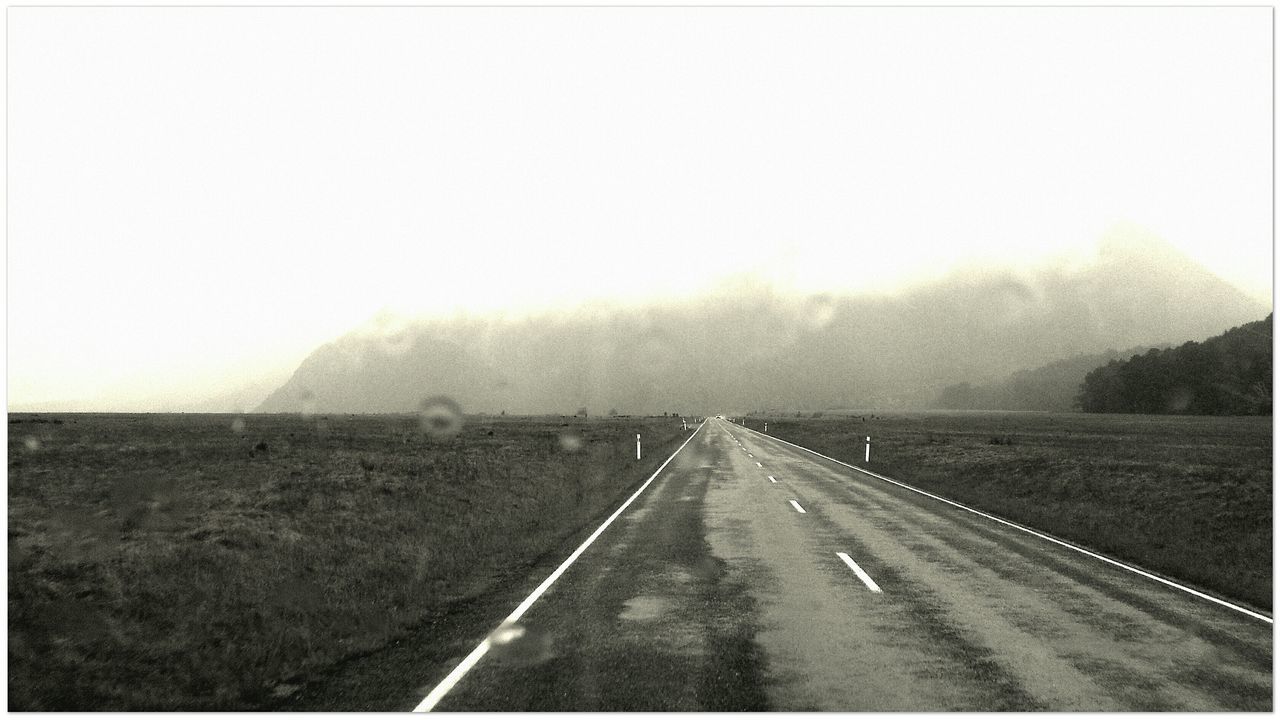 the way forward, fog, road, transportation, foggy, diminishing perspective, country road, weather, landscape, vanishing point, copy space, tranquil scene, tranquility, sky, mountain, scenics, road marking, nature, empty road