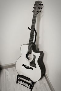 High angle view of guitar on wall at home