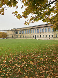 View of historic building with autumn leaves in background