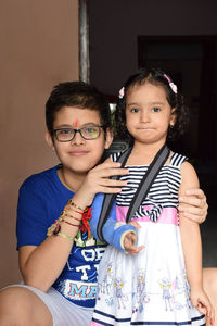 Portrait of smiling siblings