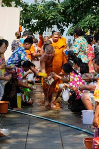 Group of people on street in city