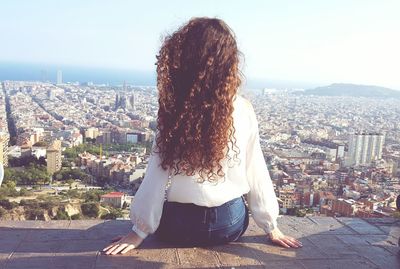 Woman looking at cityscape