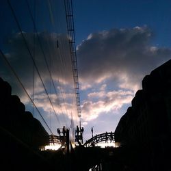 Low angle view of bridge against sky at sunset