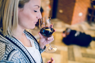 Close-up of woman drinking wine