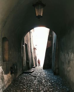 Narrow alley in tunnel