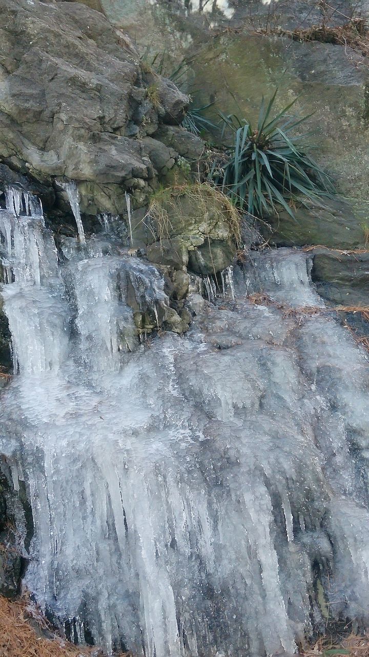 WATER FLOWING THROUGH ROCKS