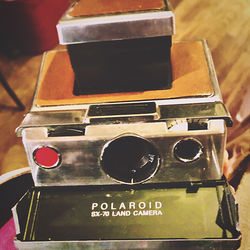 High angle view of old camera on table