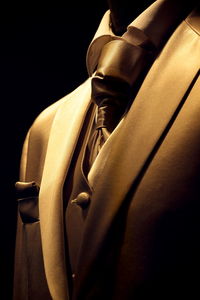 Close-up of clothes drying against black background