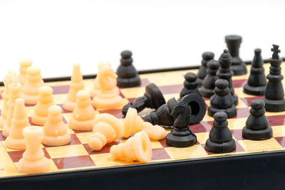 Close-up of chess against white background