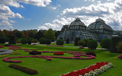 View of formal garden with trees in background