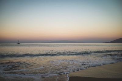 Scenic view of sea against clear sky during sunset