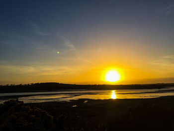 Scenic view of sea at sunset
