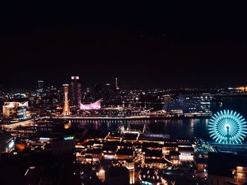 Illuminated buildings in city at night