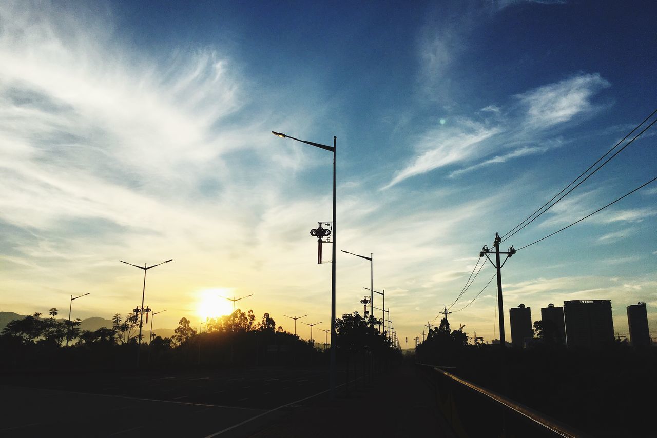 silhouette, sunset, sky, transportation, cable, cloud - sky, power line, street light, no people, road, electricity, electricity pylon, outdoors, nature, technology, telephone line, day