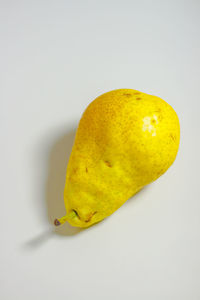 Close-up of lemon slice over white background