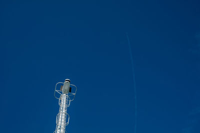 Low angle view of street light against clear blue sky