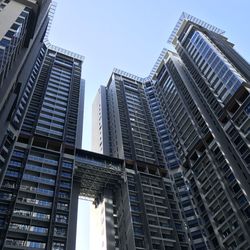 Low angle view of modern buildings against sky in city