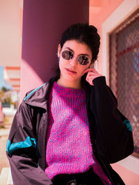 Portrait of beautiful young woman in sunglasses