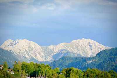 Scenic view of snowcapped mountains against sky