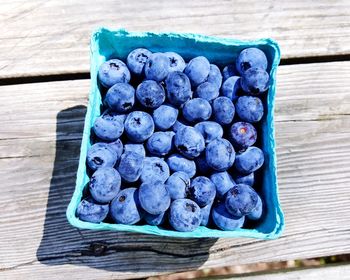 High angle view of blue fruits on table