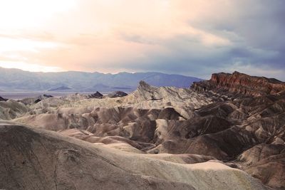 Scenic view of zabriskie point against cloudy sky at death valley national park